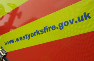 West yorkshire fire and rescue service website URL on the side of a fire engine. 