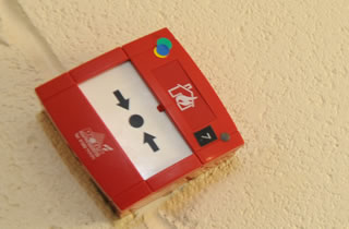 Fire alarm on the wall. 