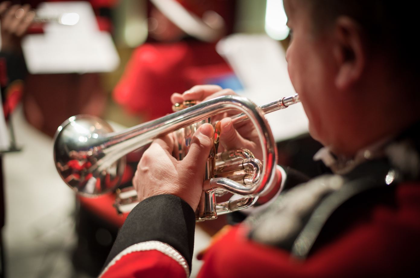 Band member playing the trumpet. 