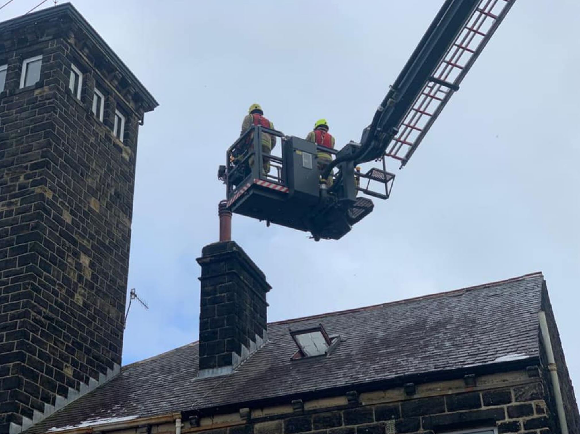 Firefighters attending a chimney.