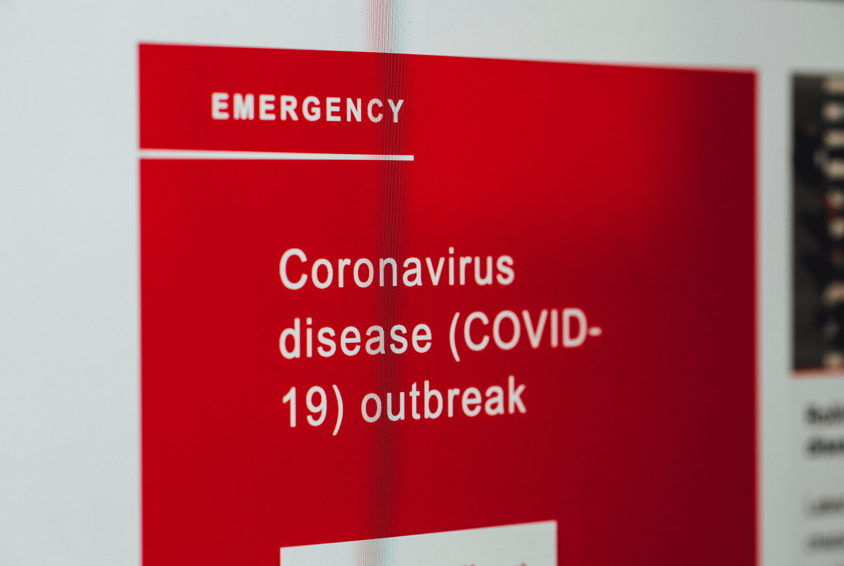 Sign on a wall reading: "Emergency, coronavirus disease (COVID-19) outbreak.