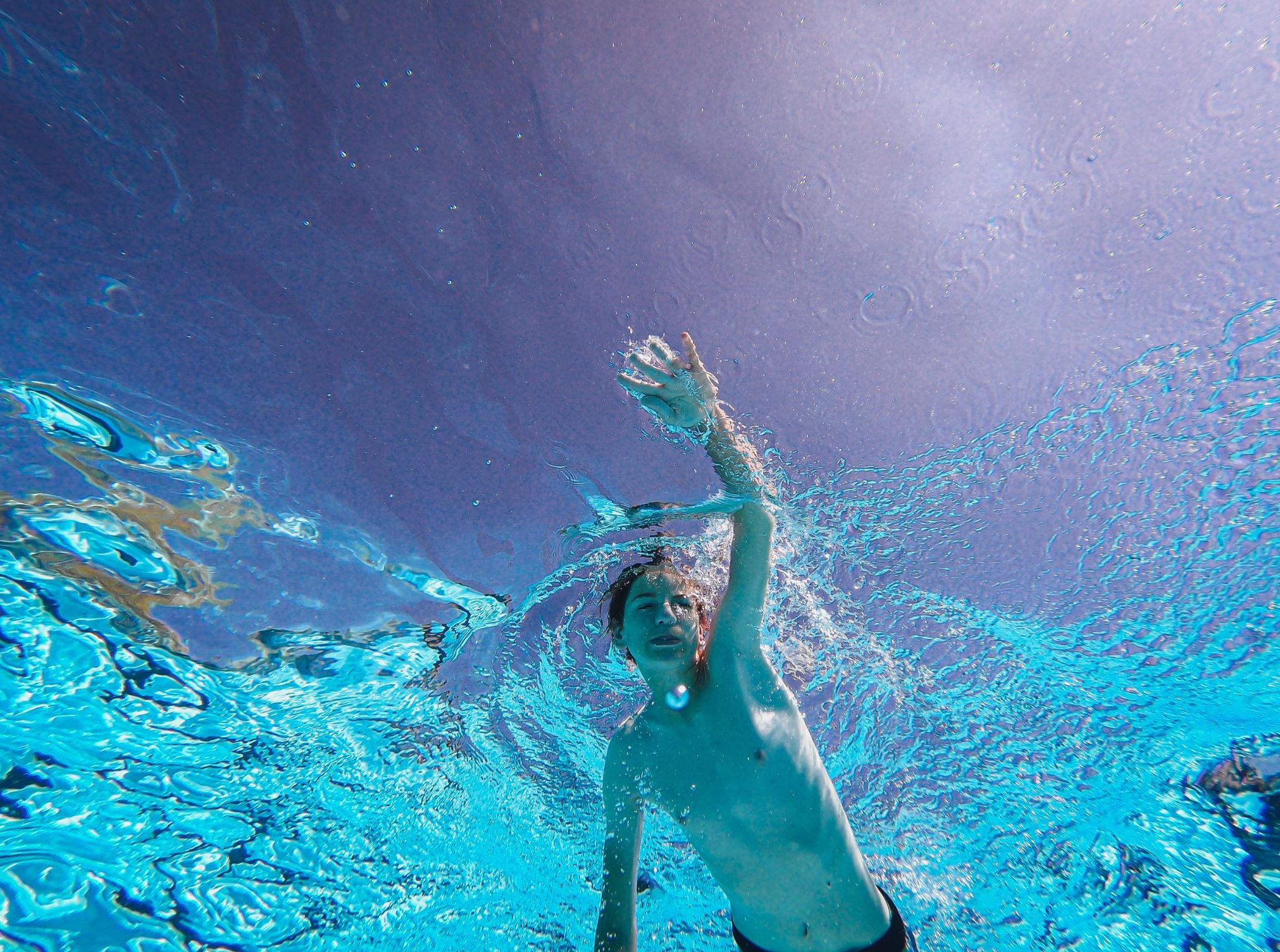 Child swimming in water. 