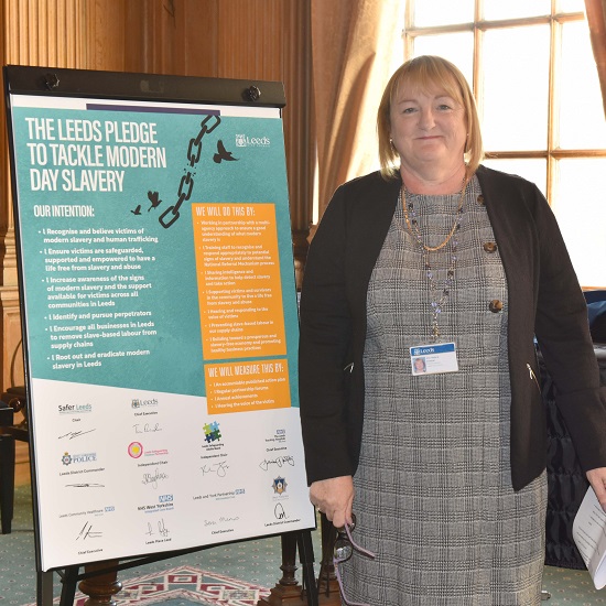 Deputy Leader of Leeds City Council with signed pledge poster