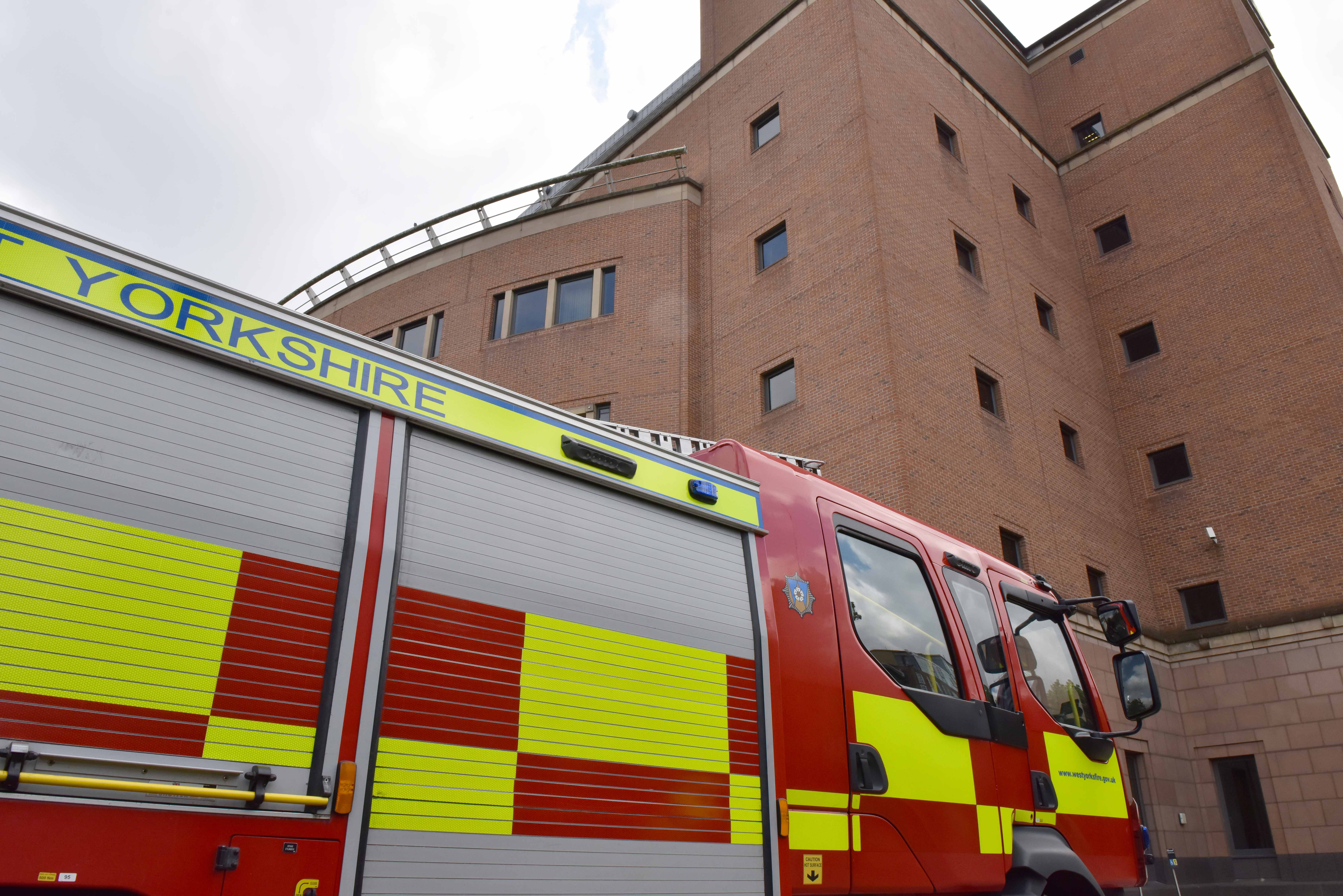 Right side of fire engine parked in front of quarry house building leeds.