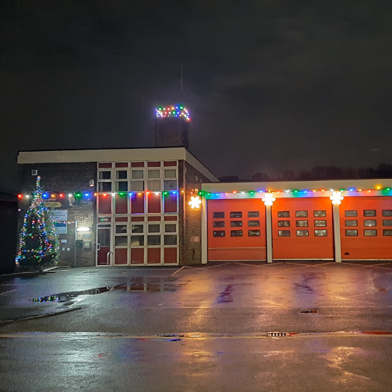 Slaithwaite Fire Station with Christmas lights and tree