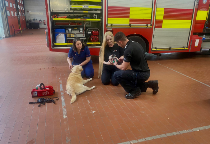 Amy and Sally show WM Bartle how to use the masks.