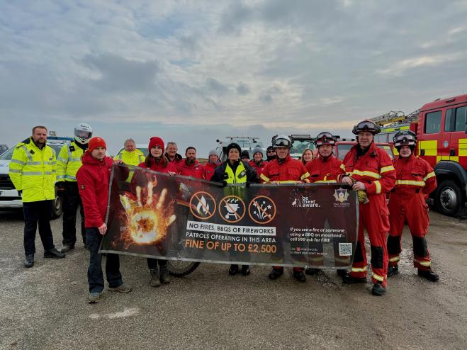 Partners holding Be Moore Aware campaign banner