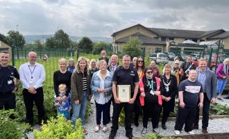 Group photo of attendees in Silsden garden