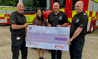 £10,000 cheque presented to Sherine Wheeler of The Fire Fighters Charity by CFO, John Roberts, Stuart Wilson and Richard Izzard