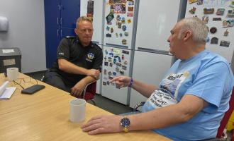 Wakefield Green Watch, Crew Manager Craig Pickles and Mr Whittaker chatting with a coffee