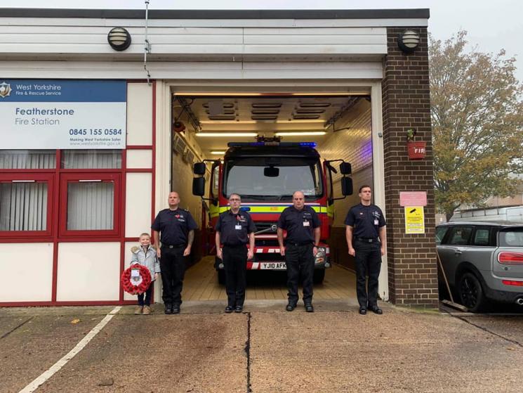 Firefighters stood in front of Featherstone Fire Station.
