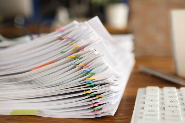 pile of paper with paper clips