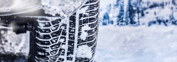 Car tyre on snow