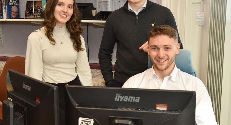 Lewis Bell, front, with apprentices Emily Chapman and Spencer Peck.