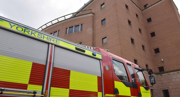 Right side of fire engine parked in front of quarry house building leeds.