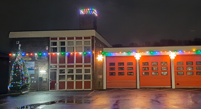 Slaithwaite Fire Station with Christmas lights and tree