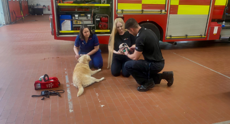 Amy and Sally show WM Bartle how to use the masks.